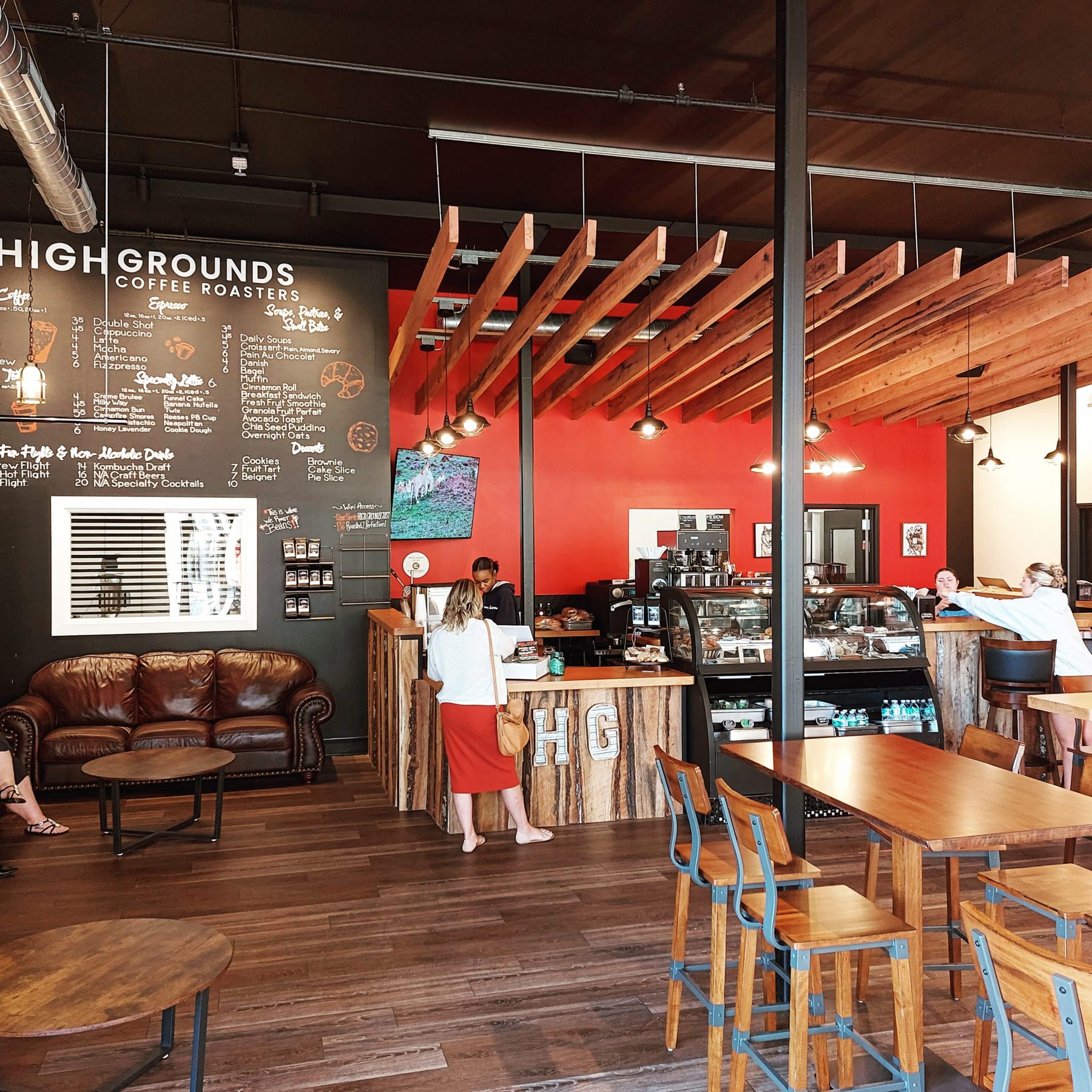 High Grounds menu wall above the counter and lounge seating in Glassboro
