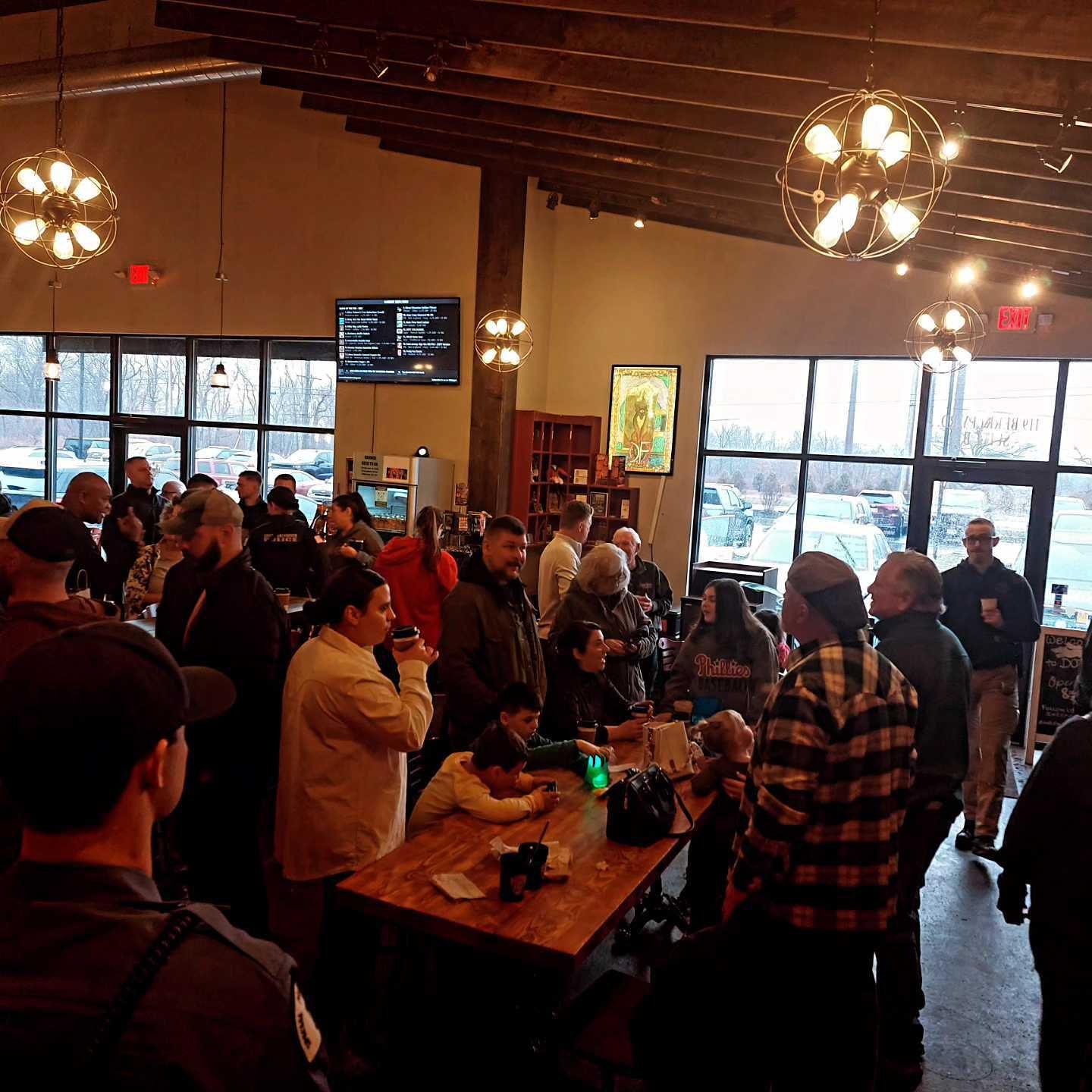 Packed Death of the Fox taproom during a morning community event