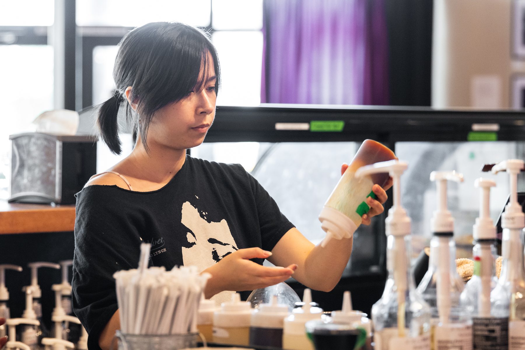 Baristas working together behind the bar