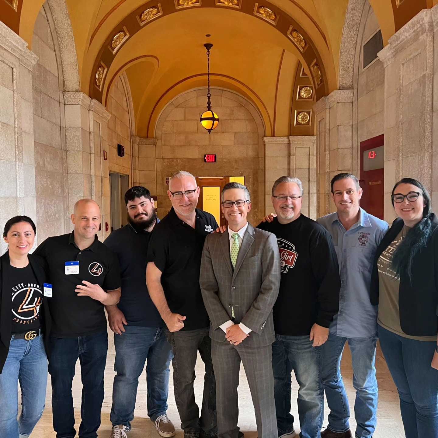 New Jersey craft brewers gathered in a statehouse hallway
