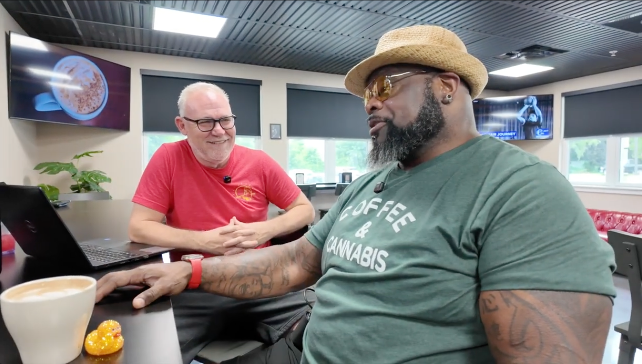 Former Eagle Hollis Thomas talking over coffee with Chuck at High Grounds Lounge