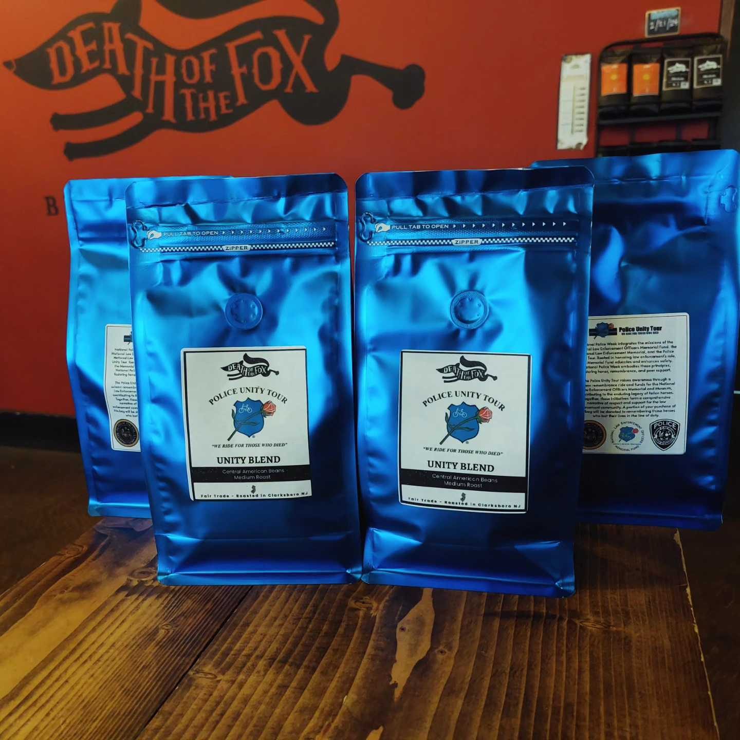 Blue bags of Police Unity Tour Unity Blend coffee roasted in Clarksboro