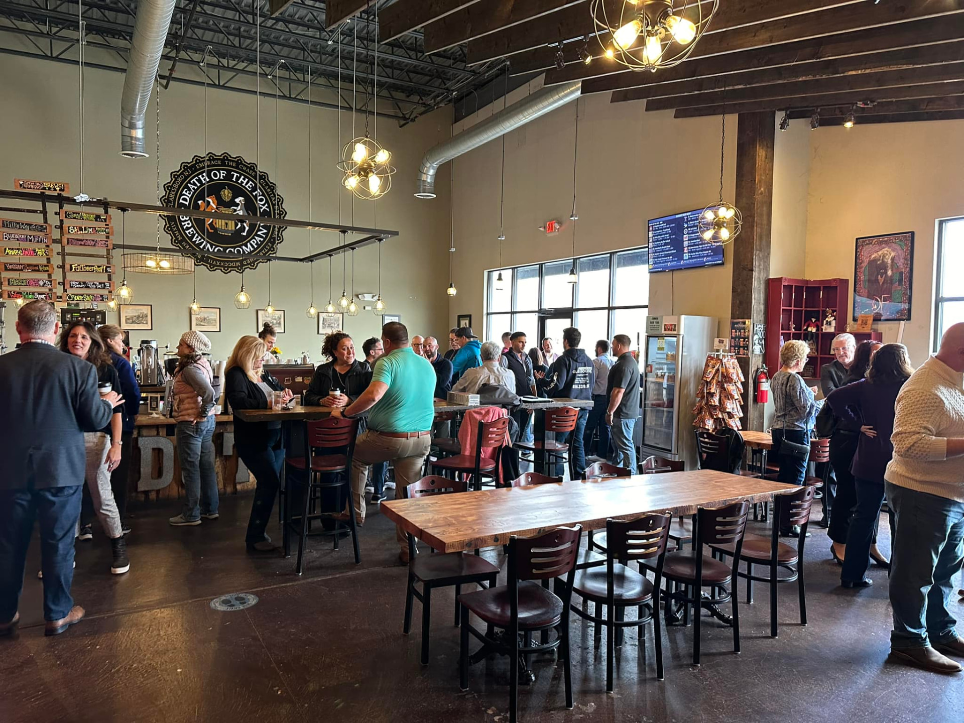 Crowd gathered for a community event in the Death of the Fox taproom in Clarksboro