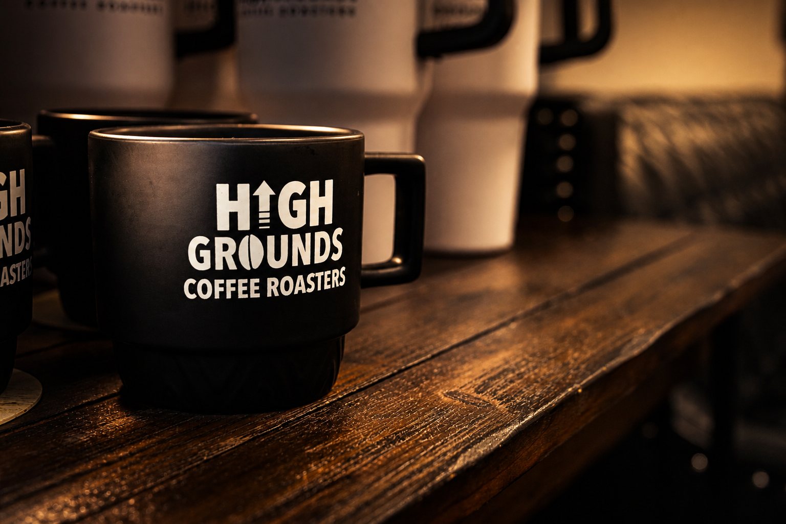 Branded High Grounds ceramic mug on the bar top