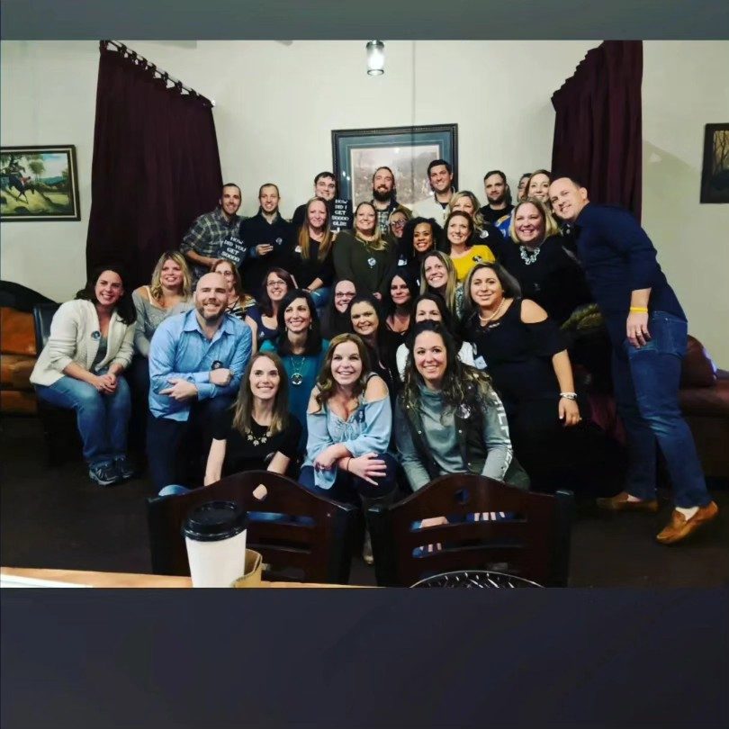 Group photo of guests at a private party at Death of the Fox