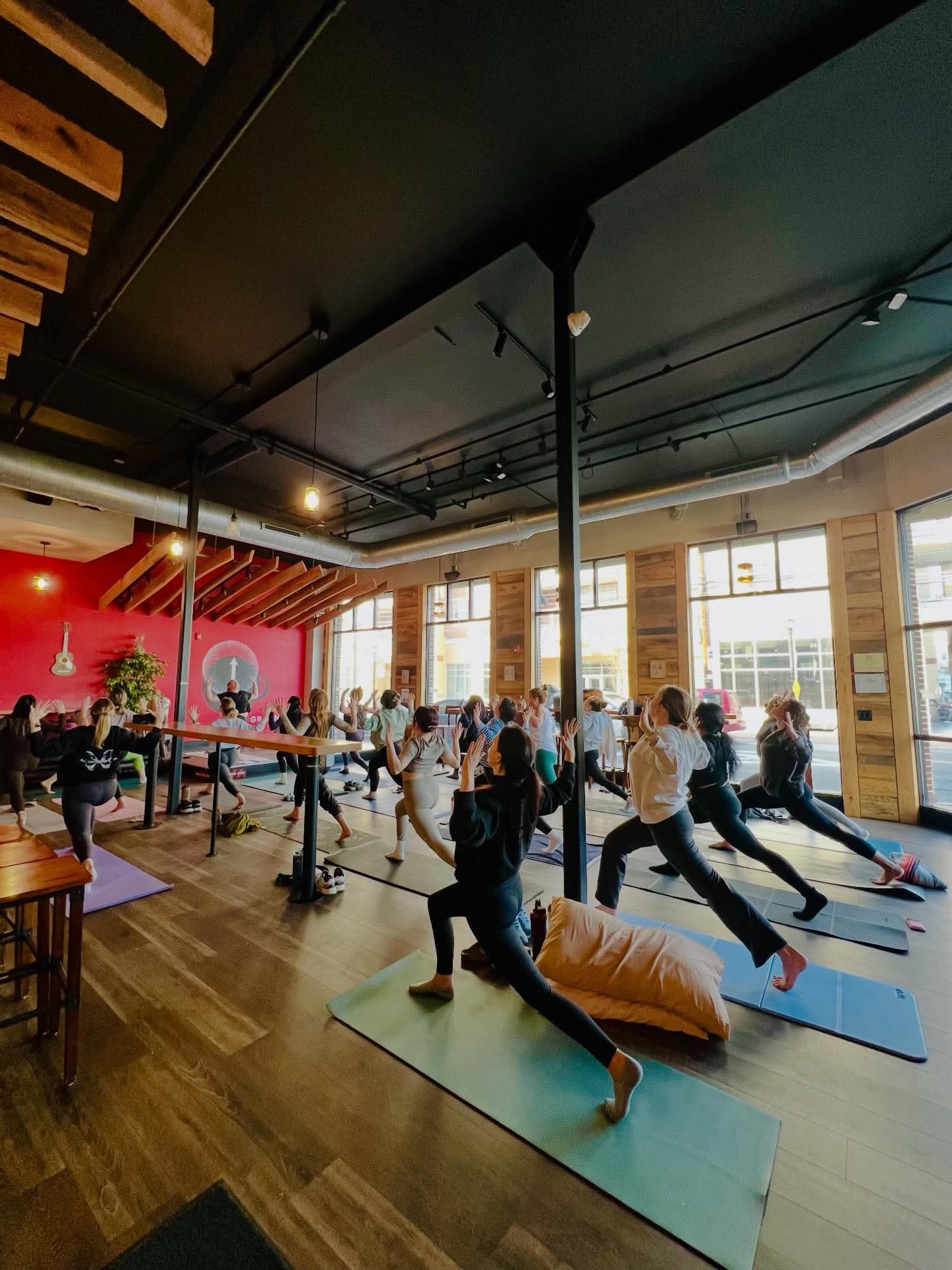 Yoga class on mats at High Grounds Coffee Roasters in Glassboro